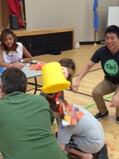 Students and families play a literacy game.